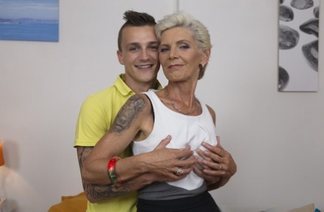 Mature housewife welcomes her younger daytime lover with a tongue kiss