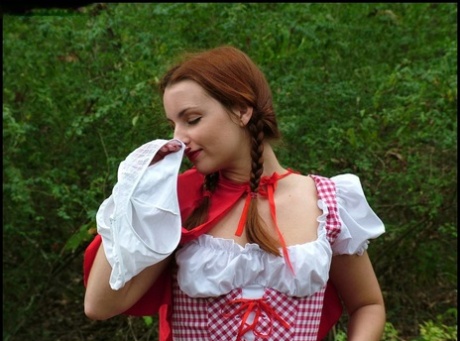 Amateur girl Amber Lily frees tits and twat from Little Red Riding Hood outfit