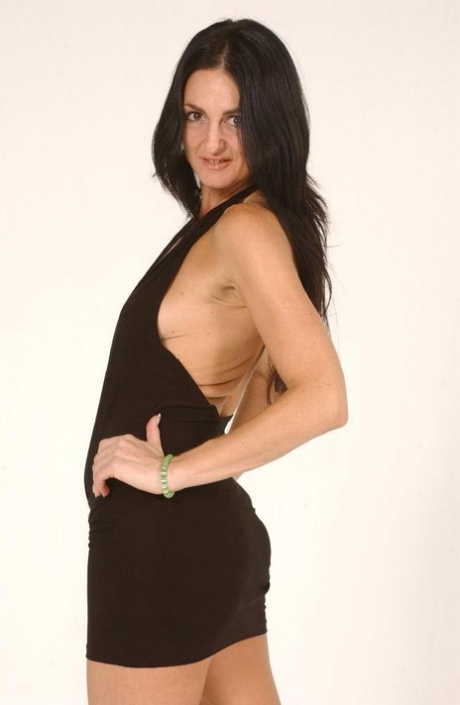 Brunette MILF Lake Russell sets her natural tits free of a short dress