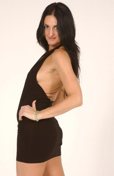 Brunette MILF Lake Russell sets her natural tits free of a short dress