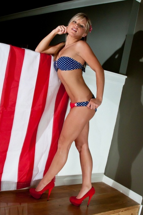 Blonde all American girl Meet Madden removes her USA themed bikini