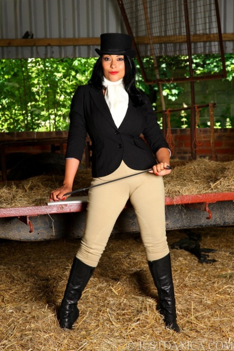 Hot MILF Danica Collins works free of riding apparel at a farm