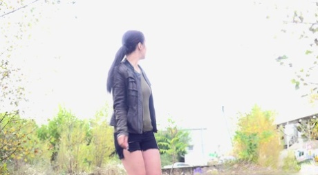 Shameless MILF Corin with a hairy snatch squats in public and takes a piss