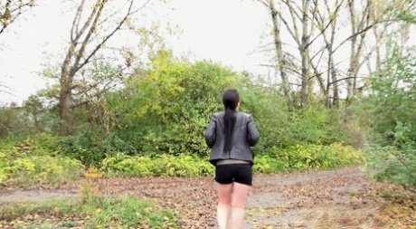 Shameless MILF Corin with a hairy snatch squats in public and takes a piss