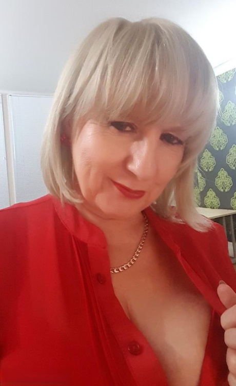 Older blonde Lorna Blu gives Santa a blowjob after being gifted a new sex toy