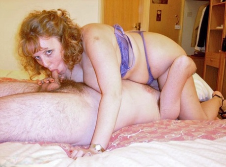 Holder UK redhead Curvy Claire gets into a 69 with a man on her bed