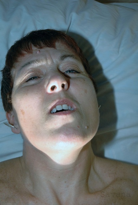 Mature redhead Savana wears her hair short during a hardcore POV fuck on a bed