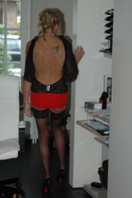 Amateur older slut Kyra in sexy dress and stockings rubbing her horny clit