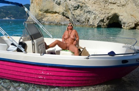 Beefy big Nude Chrissy pilots her boat naked to sun her round plump tits