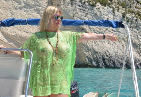 Beefy big Nude Chrissy pilots her boat naked to sun her round plump tits