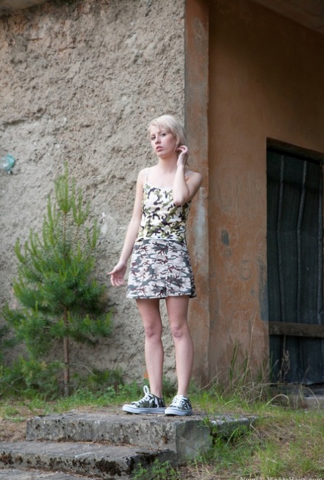 Solo girl with blonde hair undresses at a campground to air out her hairy bush