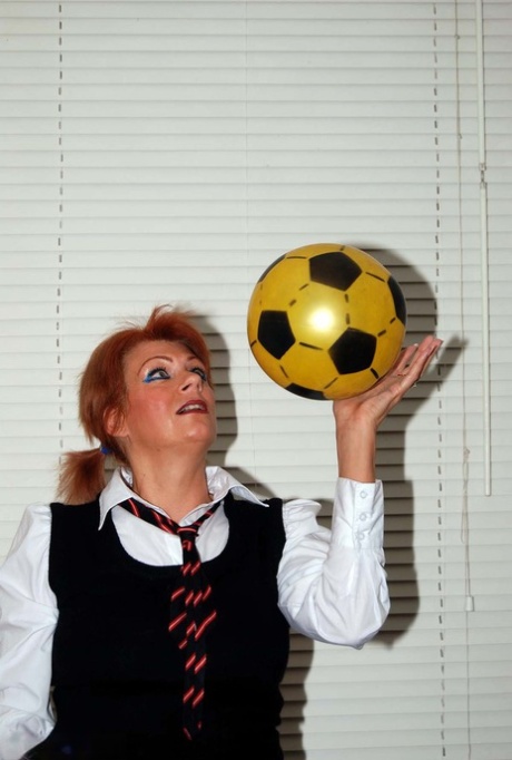 Middle-aged redhead Dimonty rubs her vagina while wearing a schoolgirl outfit