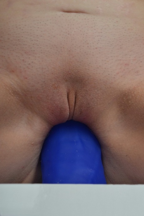 Amateur slut with saggy boobs riding a big blue dildo so damn good