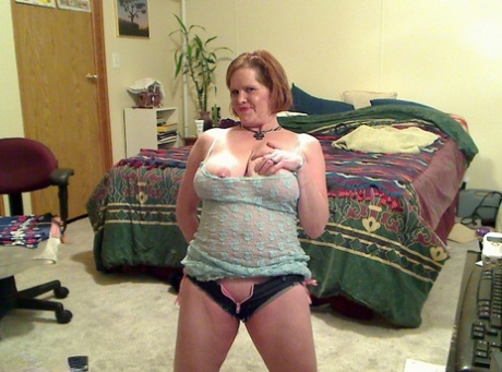 Fat mature mom Misha bares saggy boobs to fist her hot pussy on the bed