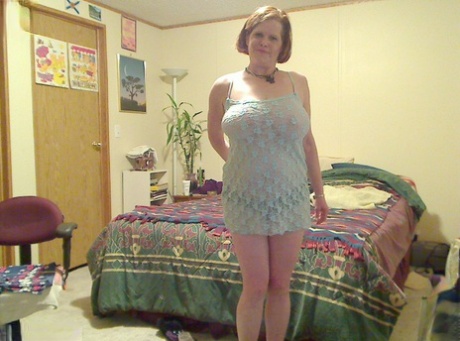 Fat mature mom Misha bares saggy boobs to fist her hot pussy on the bed