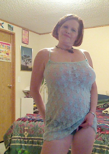 Fat mature mom Misha bares saggy boobs to fist her hot pussy on the bed
