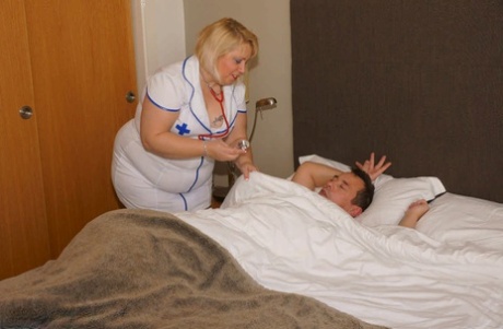 Obese blonde nurse Lexie Cummings sits on a patient's face after fucking him
