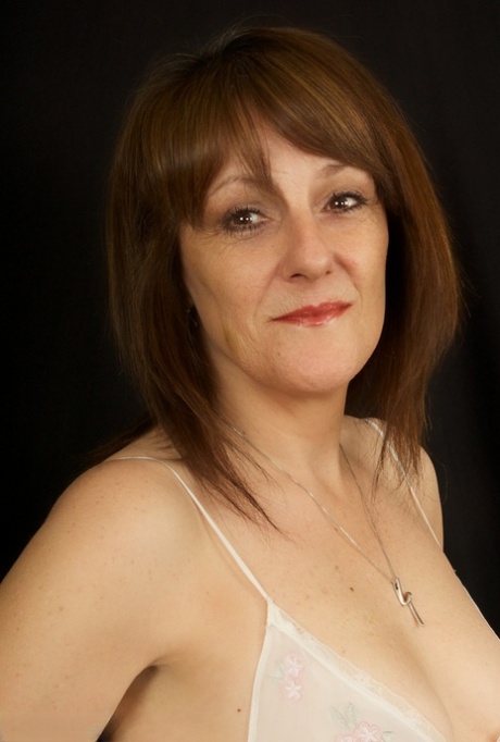 Horny older Pandora sheds sheer white lingerie to spread her mature ass