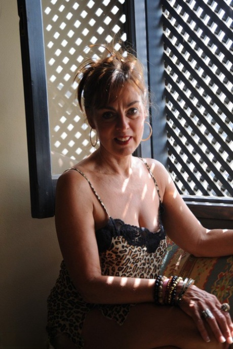 Hot mommy in sexy leopard dress Georgie masturbating at home