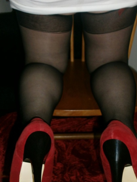 Horny granny Caro in high heels flaunting hairy armpits & mature ass