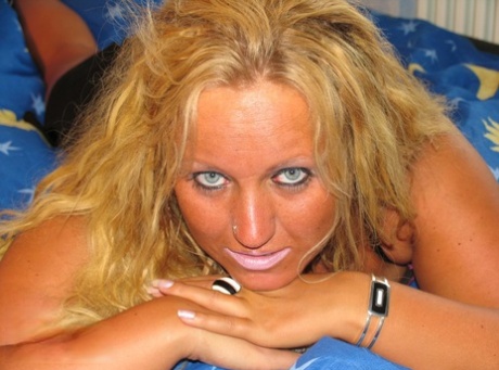 Blonde amateur gets gangbanged on her bed by black and white men