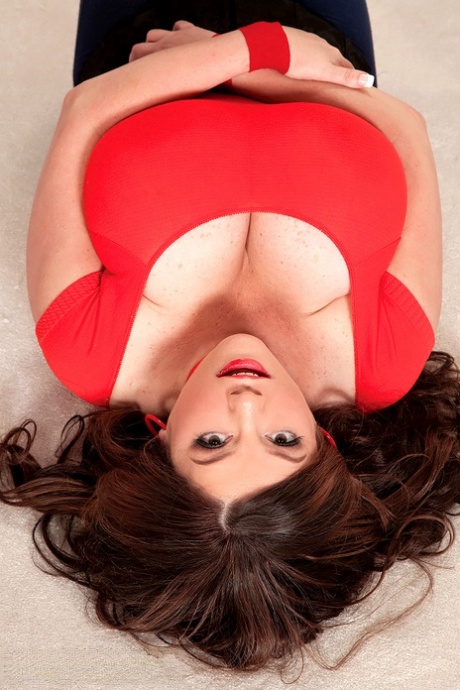 Beautiful BBW Diane Poppos unveils her massive big tits while on her knees