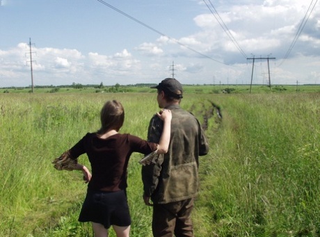 White girl fucks a homeless military man in the privacy of long grasses