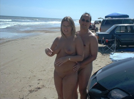 Glasses wearing amateur BBW gets gangbanged on a nude beach