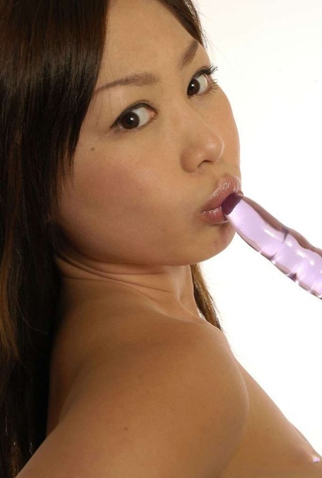 Asian solo girl pulls down her thong before dildoing her horny twat