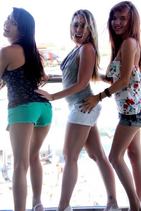 Teen amateur Andi Land and her girlfriends expose their tiny tits and butts