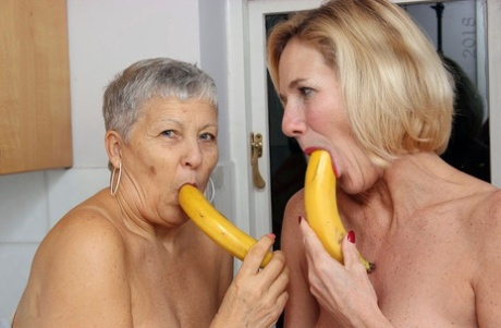 Granny lesbians lick each others nipples before using bananas as dildos