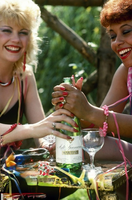 Horny females with retro hairstyles do each other and guys too in a field