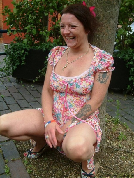 Old British woman squats atop a beer bottle while masturbating in public