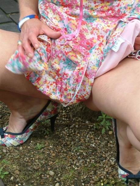Old British woman squats atop a beer bottle while masturbating in public