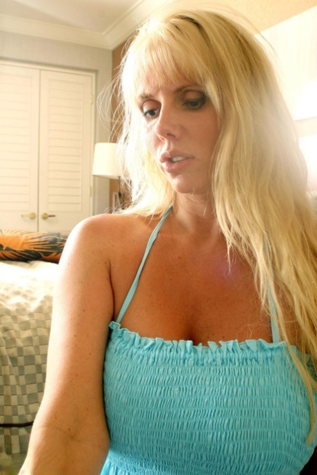 Blonde MILF Karen Fisher takes her man friend's penis in her mouth