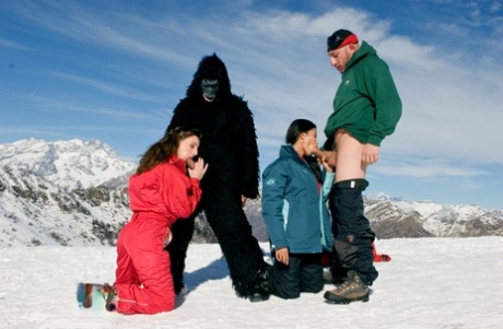 Sexy girls have a foursome on a ski slope which happens to involves a gorilla