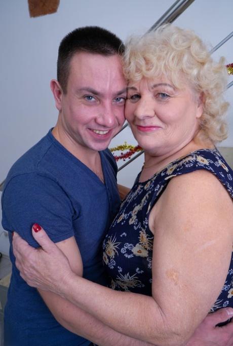 Old blonde woman cheats on her husband with a much younger gentleman