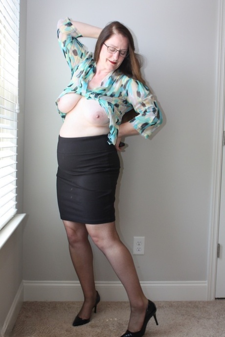 Mature fatty Missy uncovers her boobs before sliding a hand down see thru hose