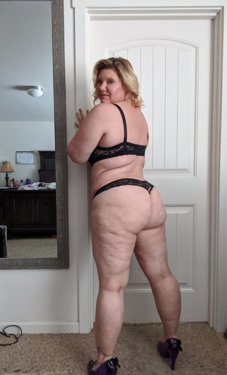 Mature BBW Kris Ann pinches her nipples before masturbating around her house