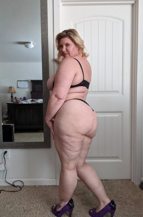 Mature BBW Kris Ann pinches her nipples before masturbating around her house