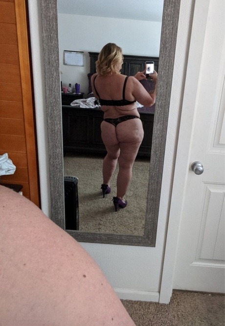 Mature BBW Kris Ann pinches her nipples before masturbating around her house