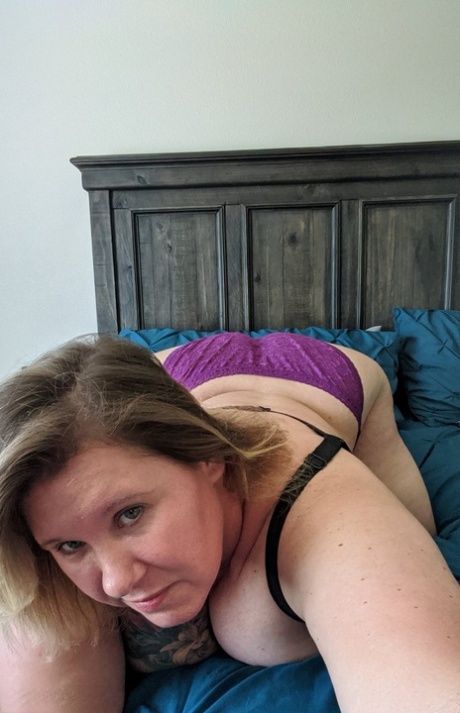 Older BBW Kris Ann takes self shots of her large tits during solo action