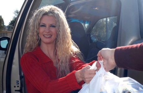 Middle-aged blonde Victoria Givens goes grocery shopping before a fuck