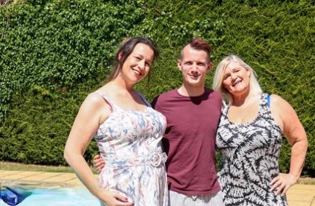 Mature fatties catch jizz on their tits during a threesome with a young lad