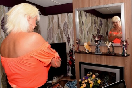Mature amateur Dimonty models non nude in an off shoulder top and tight pants
