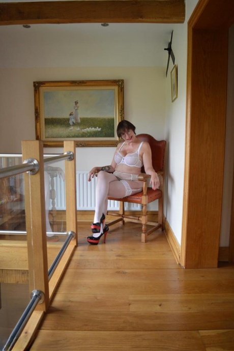 Older amateur Barby Slut sucks on a finger while modeling pretties and hosiery