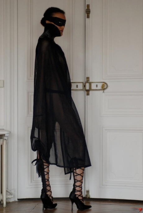 Brazilian female Angelique exposes her long legs while wearing a mask
