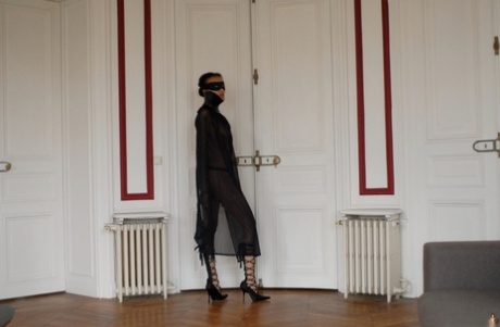 Brazilian female Angelique exposes her long legs while wearing a mask