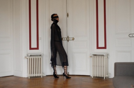 Brazilian female Angelique exposes her long legs while wearing a mask