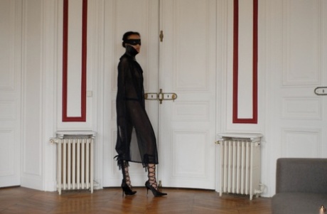 Brazilian female Angelique exposes her long legs while wearing a mask